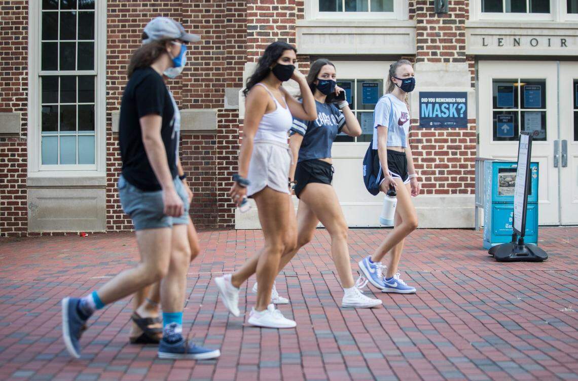 Recently arrived UNC-Chapel Hill students walk past Lenior Dining Hall on Thursday, Aug. 6, 2020.