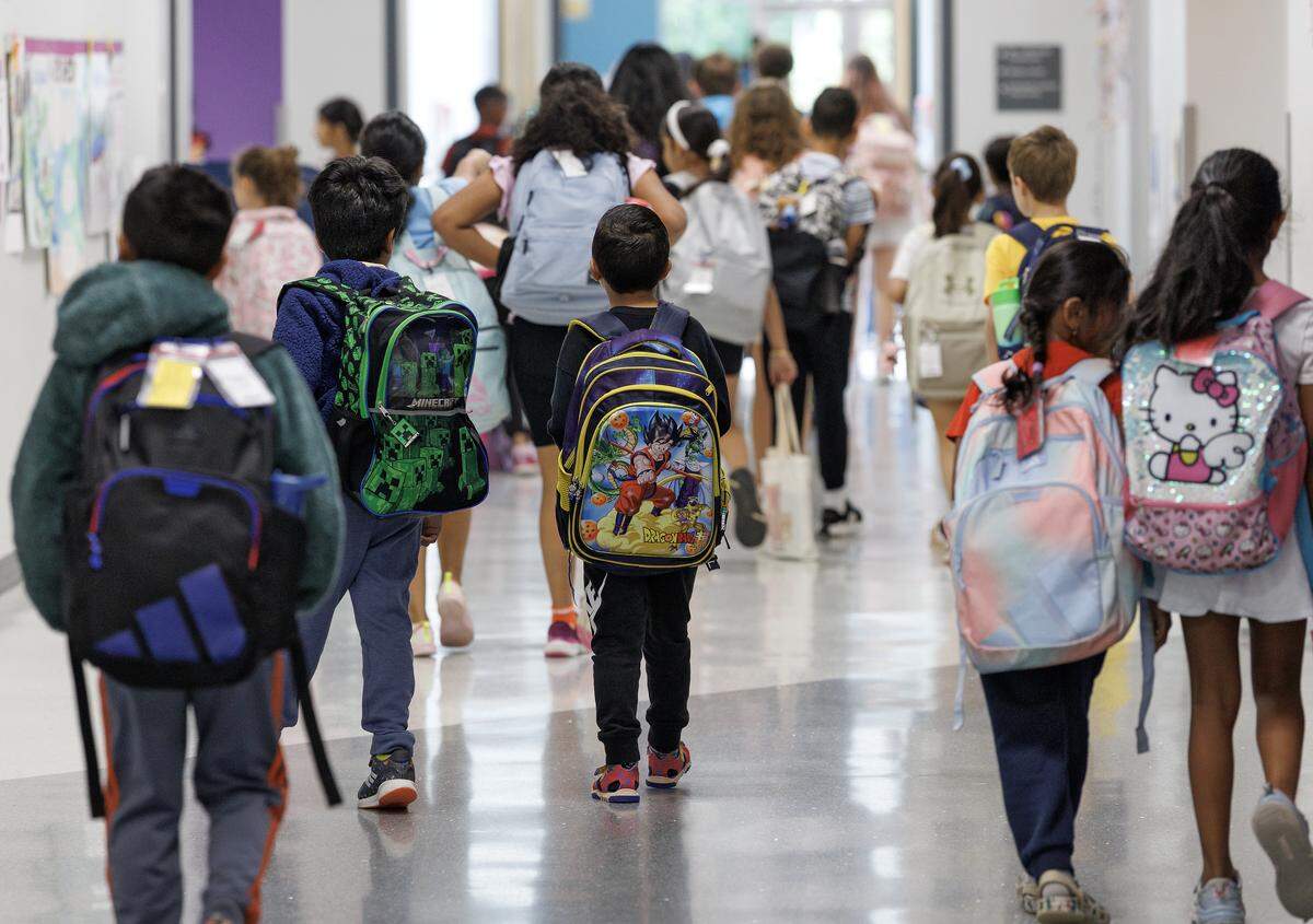Students walk to class at the start of the school day at Apex Friendship Elementary School on Tuesday, May 5, 2026.