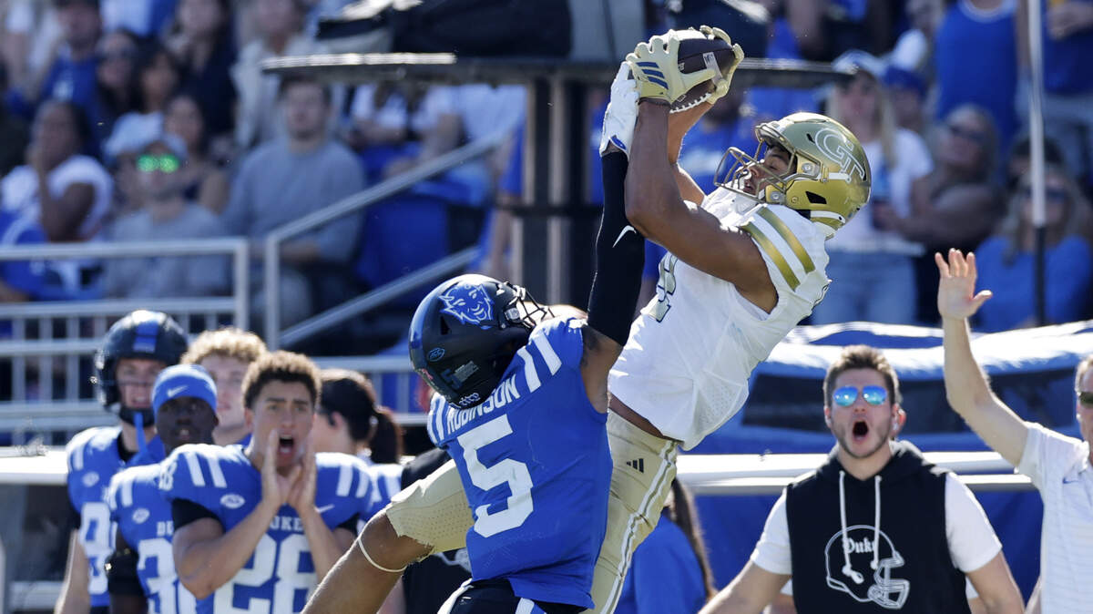 Georgia Tech wide receiver Isiah Canion (4) pulls in a 30-yard reception while defended by Duke cornerback Kimari Robinson (5) during the second half of Georgia Tech’s 27-18 victory over Duke at Wallace Wade Stadium in Durham, N.C., Saturday, Oct. 18, 2025.