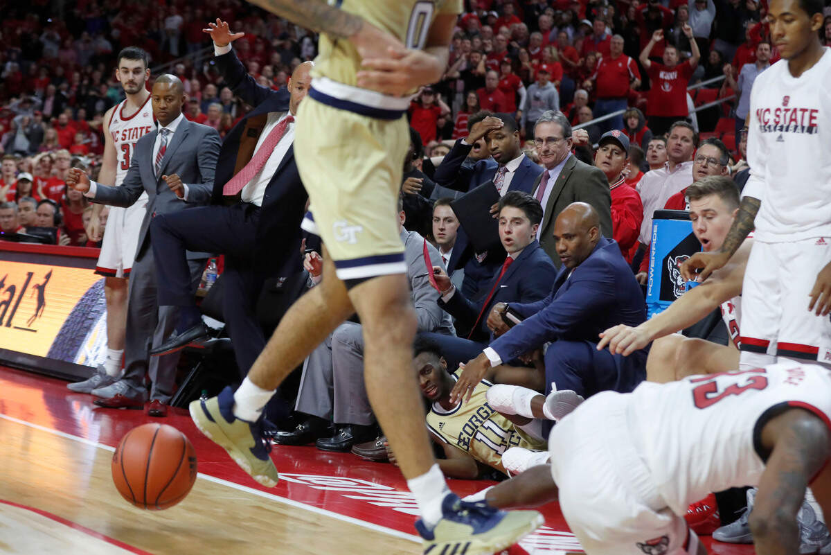 The N.C. State bench reacts after Devon Daniels turned the ball over late in overtime during Georgia Tech’s 82-81 overtime victory over N.C. State at PNC Arena in Raleigh, N.C., Tuesday, Nov. 5, 2019.