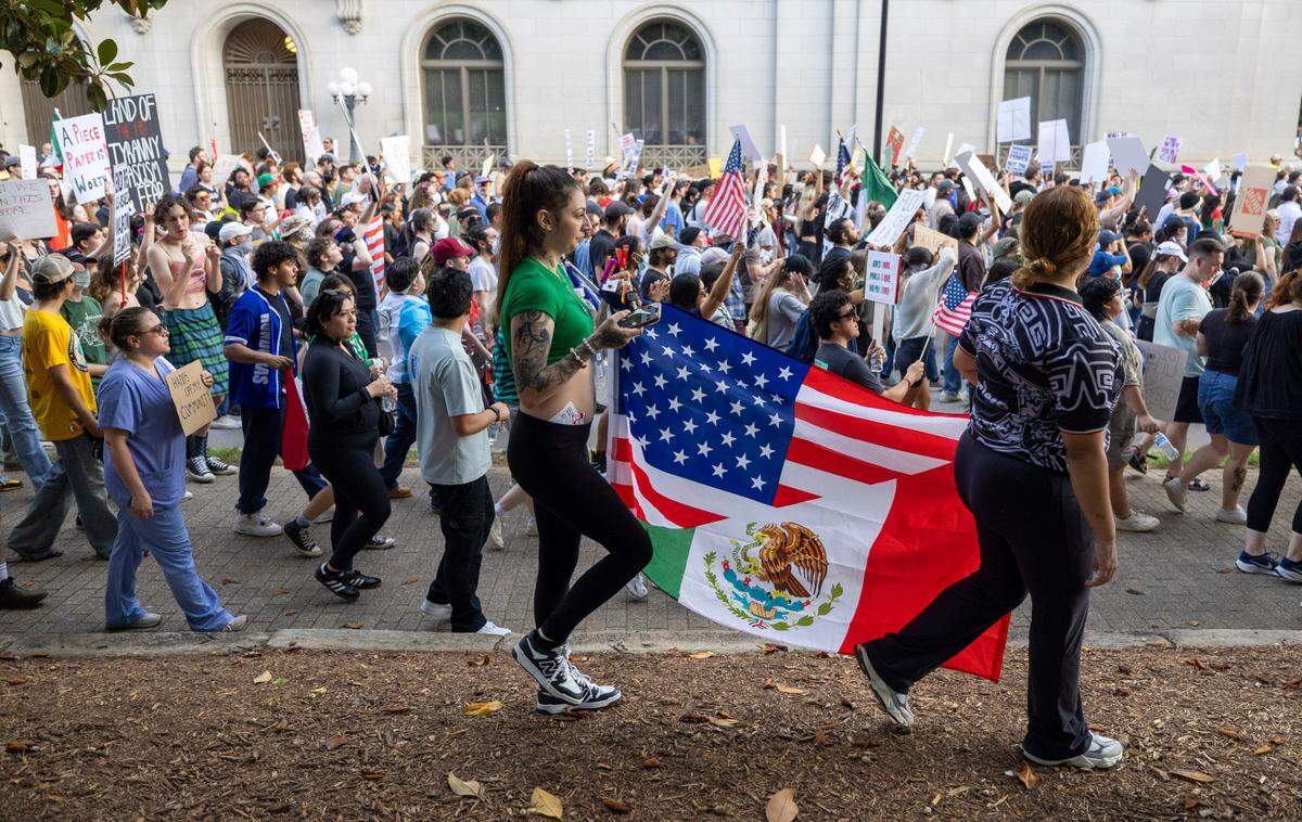 Hundreds march along Morgan Street and on the the State Capitol grounds, many carrying the flags of Mexico and the United States, calling for immigration reform during the ‘Ice out of Raleigh’ march on Wednesday, June 11, 2025 in Raleigh, N.C.