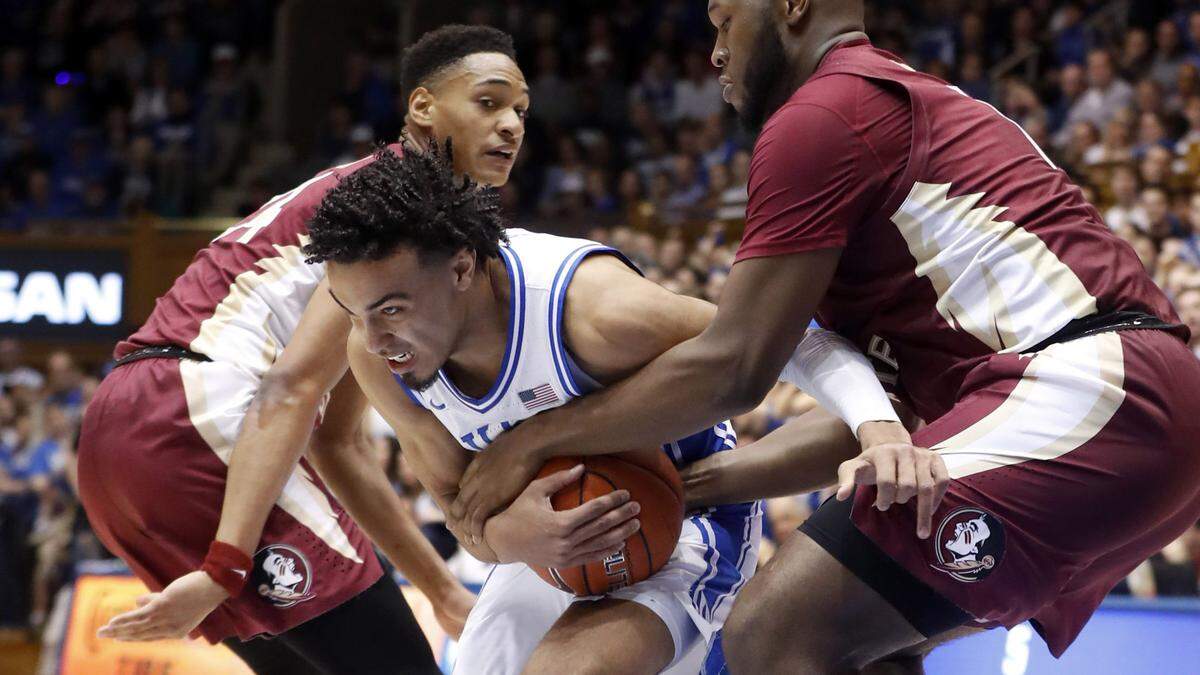 Duke’s Tre Jones (3) drives by Florida State’s RaiQuan Gray (1) during the first half of Duke’s game against Florida State at Cameron Indoor Stadium in Durham, N.C., Monday, Feb. 10, 2020.