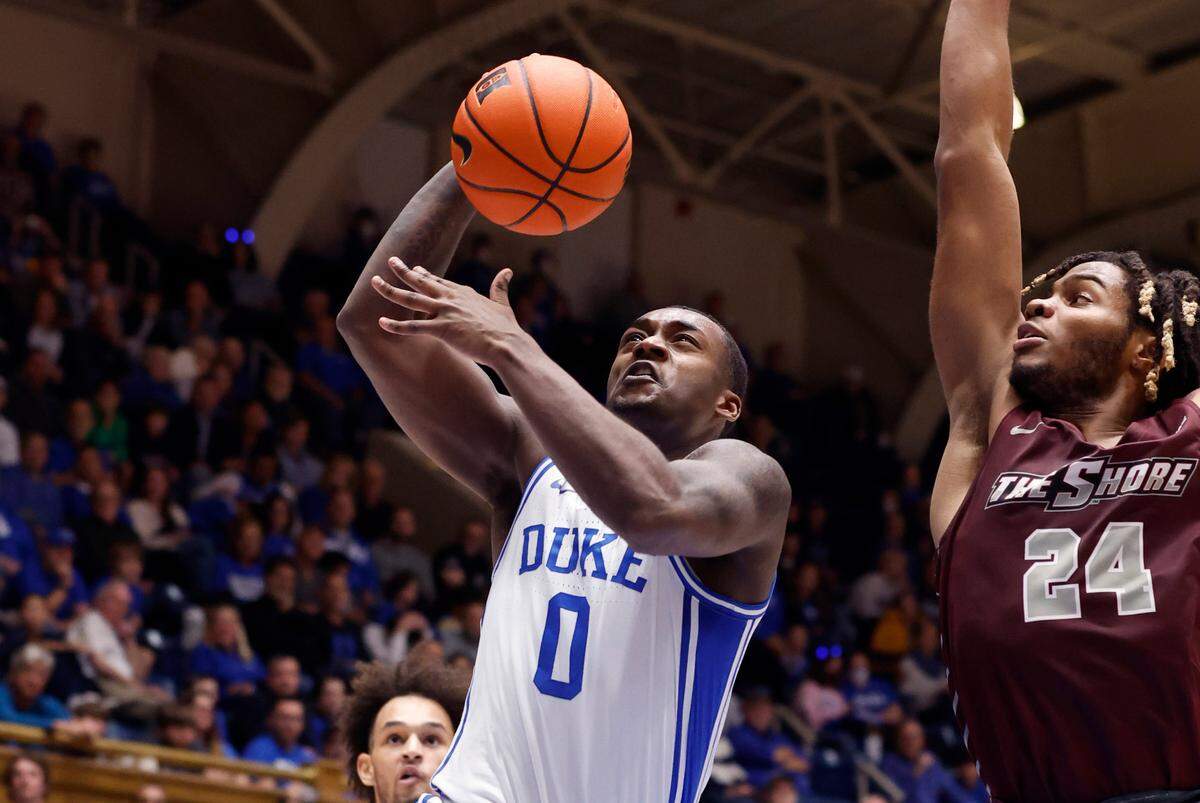 Duke’s Dariq Whitehead (0) heads to the basket to slam in two past Maryland-Eastern Shore’s Troy Hupstead (24) during the second half of Duke’s 82-55 victory over Maryland-Eastern Shore at Cameron Indoor Stadium in Durham, N.C., Saturday, Dec. 10, 2022.