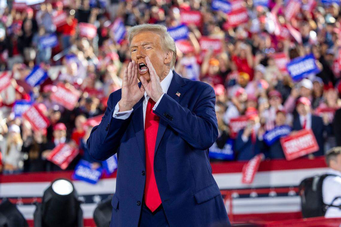 Republican presidential nominee and former President Donald Trump leaves the stage following a rally at Dorton Arena in Raleigh on Monday, Nov. 4, 2024, one day before Election Day.