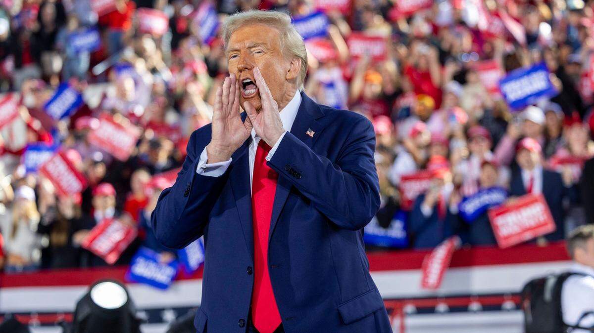 Republican presidential nominee and former President Donald Trump leaves the stage following a rally at Dorton Arena in Raleigh on Monday, Nov. 4, 2024, one day before Election Day.