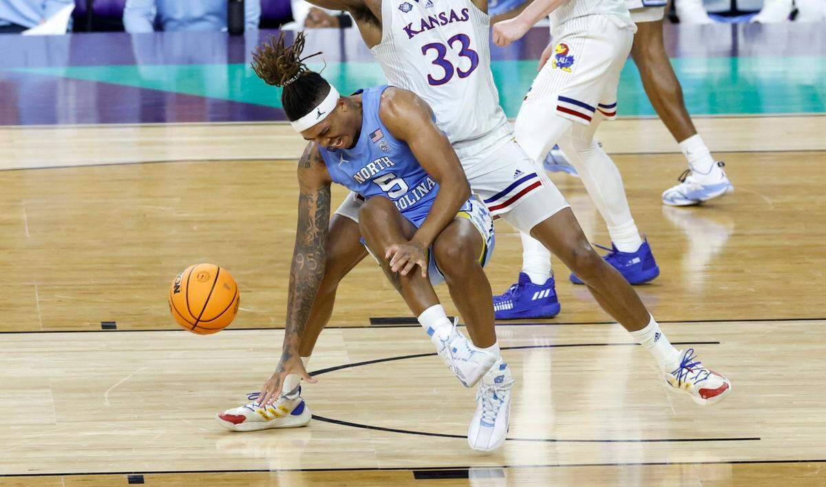 North Carolina’s Armando Bacot (5) winces in pain after being injured late in the second half of Kansas 72-69 victory over UNC in the NCAA Mens National Championship at the Caesars Superdome in New Orleans, La., Monday, April 4, 2022.
