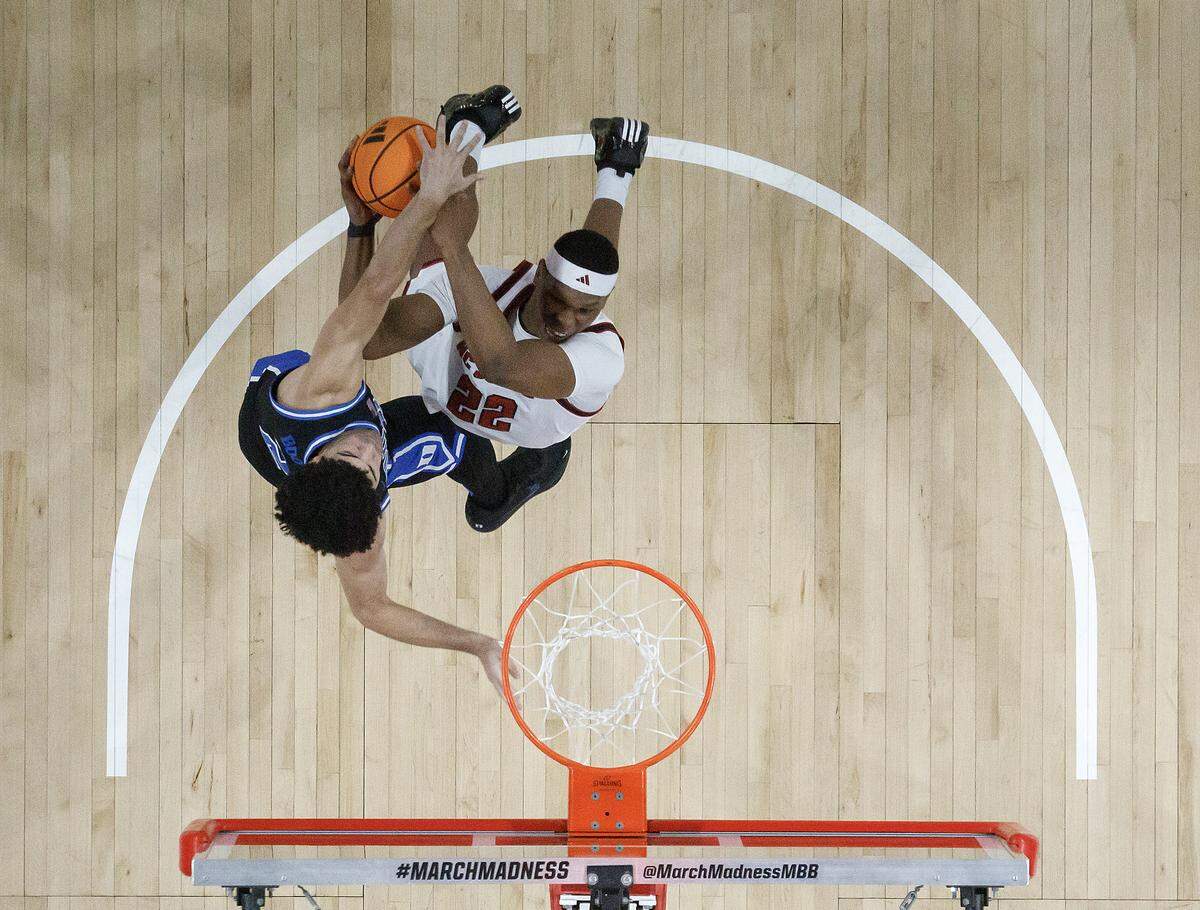 NC State's Ven-Allen Lubin drives to the basket against Duke’s Cayden Boozer during the first half of the Wolfpack’s 93-64 loss on Monday, March 2, 2026, at Lenovo Center in Raleigh, N.C.