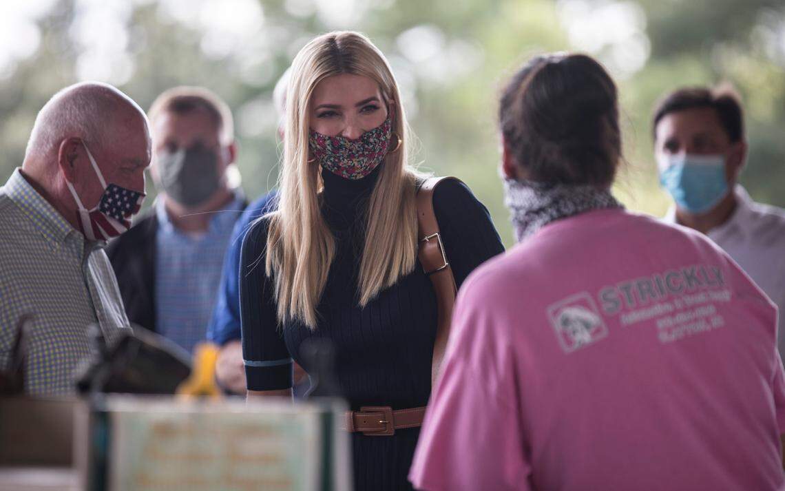 Ivanka Trump laughs with Debra Slaughter, a farmer from Meadow, N.C., as she tours the North Carolina State Farmers Public Market in Raleigh, N.C. on Thursday, Sept. 10, 2020 before an event highlighting the federal Farmers to Families Food Box Program.