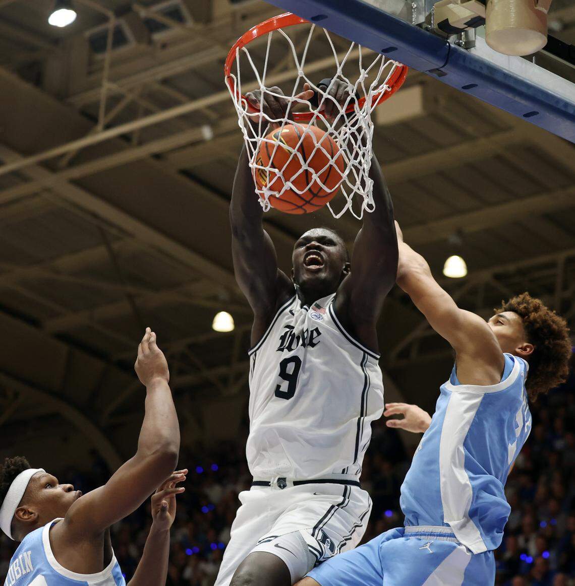 Duke’s Khaman Maluach dunks over UNC defenders in first half action, Saturday, Feb. 1, 2025.