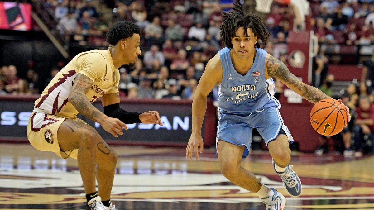 Jan 27, 2024; Tallahassee, Florida, USA; North Carolina Tarheels guard Elliot Cadeau (2) drives around Florida State Seminoles guard Primo Spears (23) during the second half at Donald L. Tucker Center. Mandatory Credit: Melina Myers-USA TODAY Sports