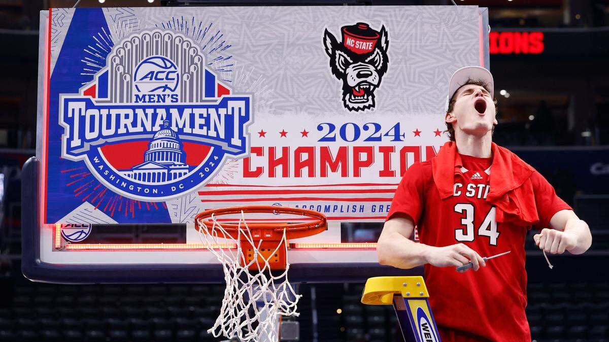 N.C. State’s Ben Middlebrooks (34) celebrates after cutting the net after the Wolfpack’s 84-76 victory over UNC in the championship game of the 2024 ACC Men’s Basketball Tournament at Capital One Arena in Washington, D.C., Saturday, March 16, 2024.