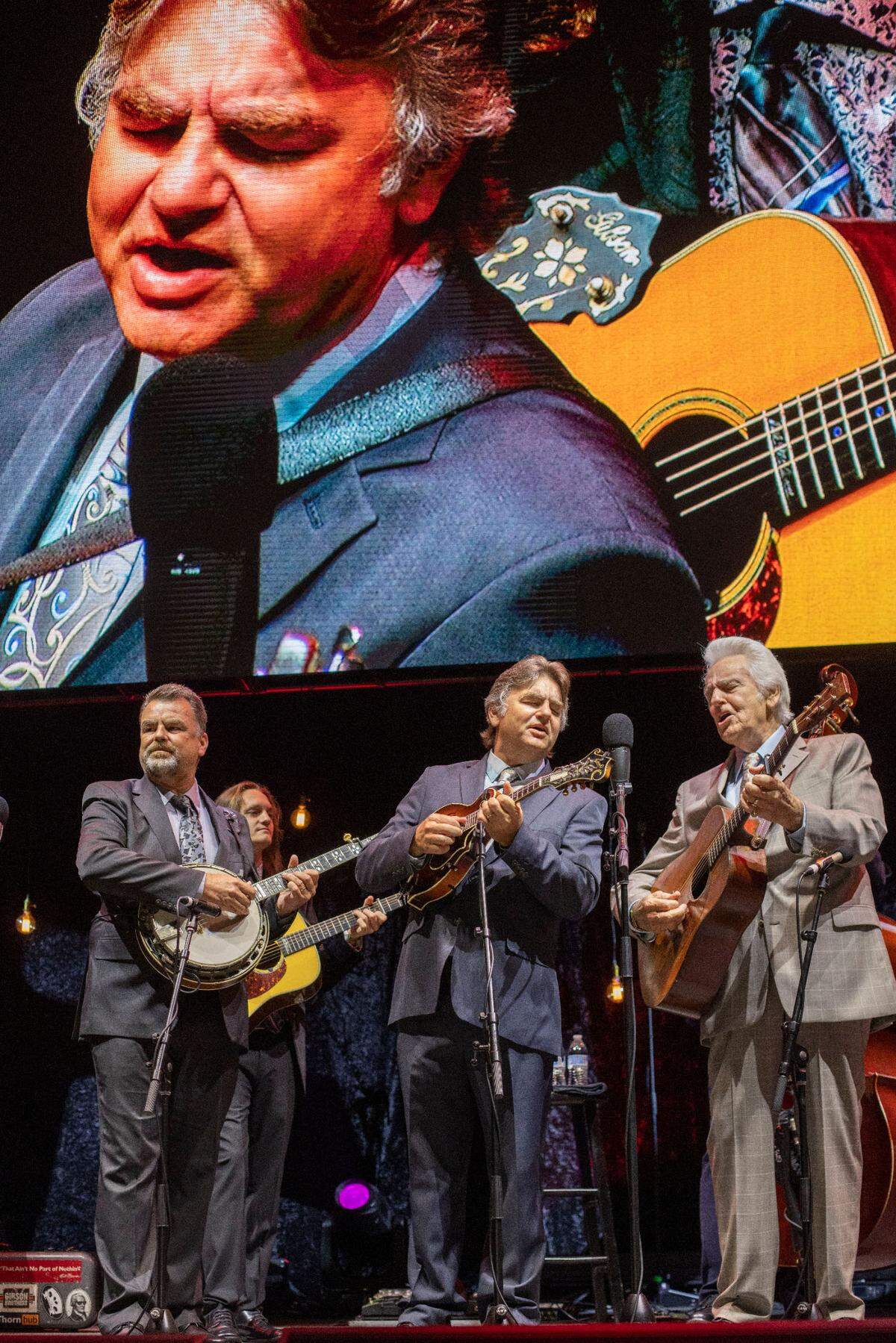 Del McCoury sings with his son Ronnie McCoury during the IBMA Bluegrass Live at Red Hat Amphitheater on Friday, October 1, 2021 in Raleigh, N.C.