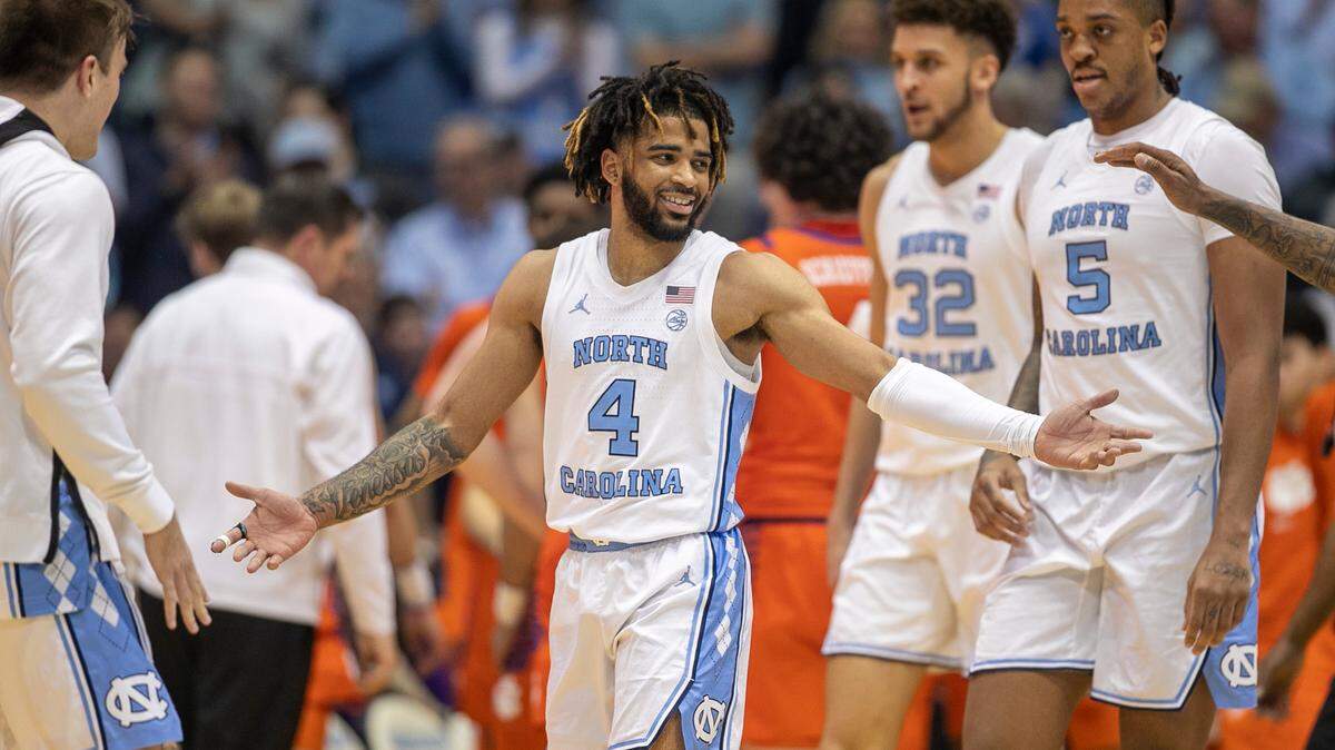 North Carolina’s R.J. Davis (4) is greeted by teammates after sinking a three point basket in the second half against Clemson on Saturday, February 11, 2023 at the Smith Center in Chapel Hill , N.C.