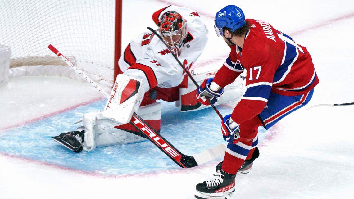 Carolina Hurricanes goaltender Frederik Andersen makes a save on Montreal Canadiens’ Josh Anderson during the first period of an NHL hockey game Thursday, Oct. 21, 2021, in Montreal. (Paul Chiasson/The Canadian Press via AP)