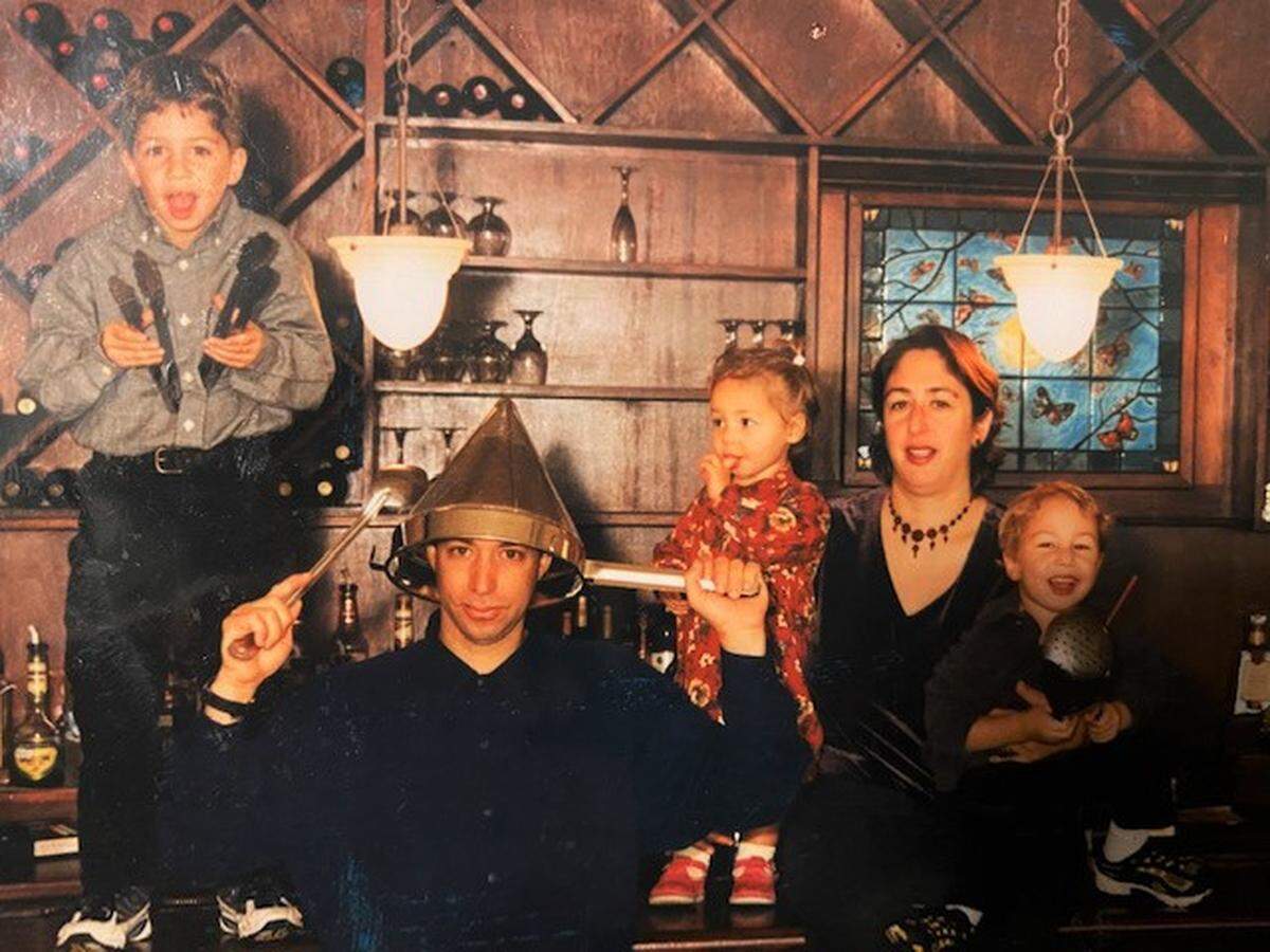 The Agasi family, from left to right, Ziv, Sarig, Maytal, Nancy and Geffen, pose for their 1999 holiday card at their North Raleigh restaurant Butterflies.