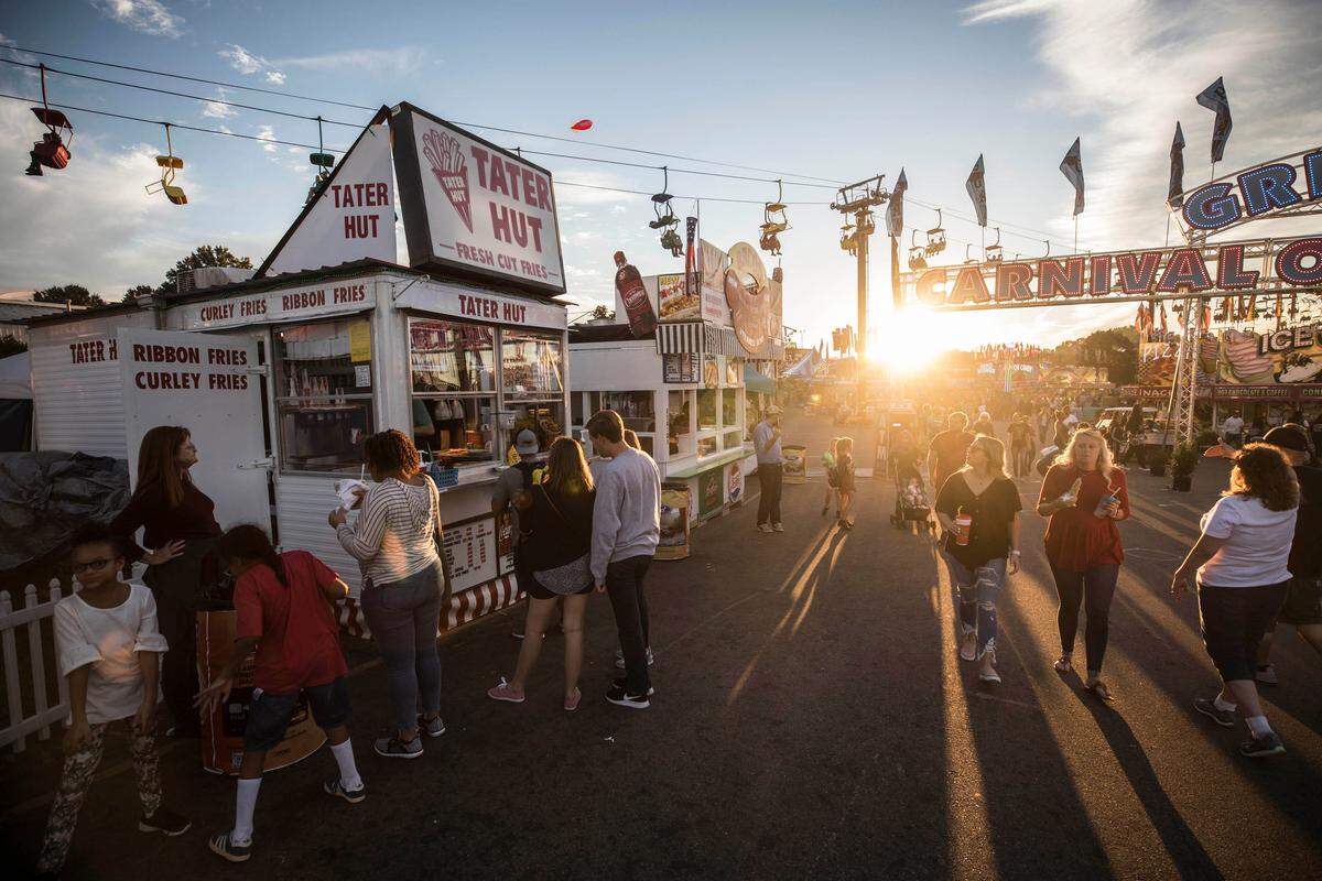The Tater Hut, a popular mom and pop vendor, specializes in fresh-cut french fries. Employees stay busy day and night during the 11-day N.C. State Fair. The last day to indulge in fair food is this Sunday.