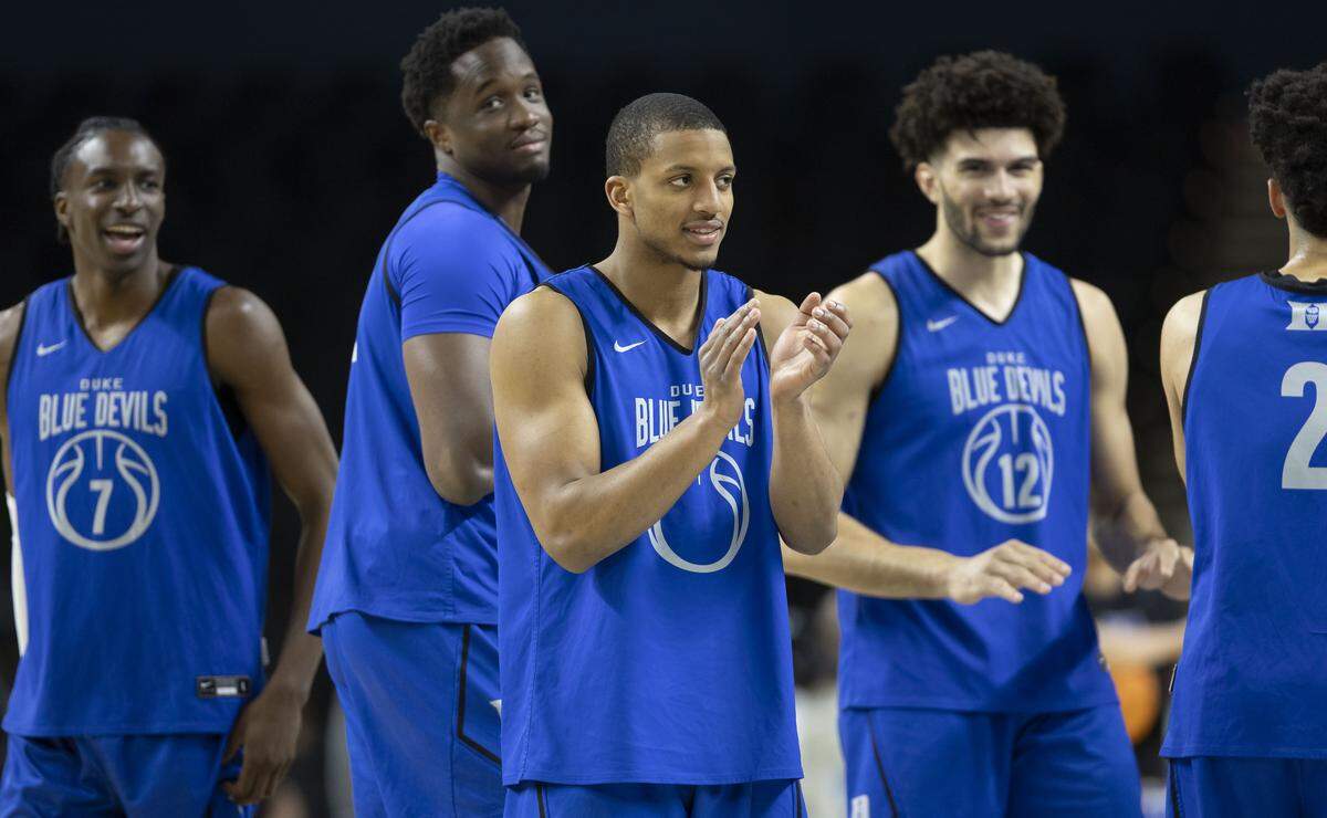 Duke walk-on Brock Davis, center, applauds his teammates during the Blue Devils’ practice on Wednesday, March 18, 2026, at Bon Secours Arena in Greenville, S.C.