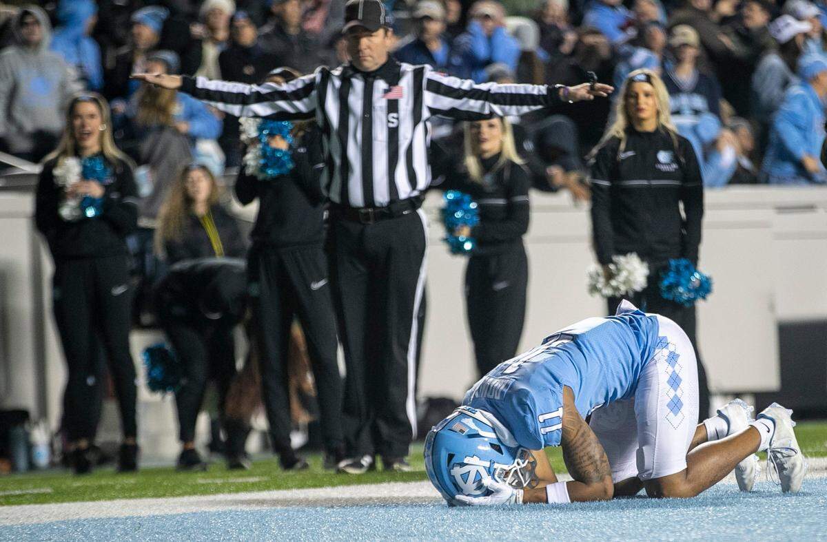 North Carolina’s Josh Downs (11) reacts after dropping a pass from quarterback Drake Maye on fourth down with 4:10 to play in the fourth quarter on Saturday, November 19, 2022 at Kenan Stadium in Chapel Hill, N.C. The Tar Heels fell to the Yellowjackets 21-17.