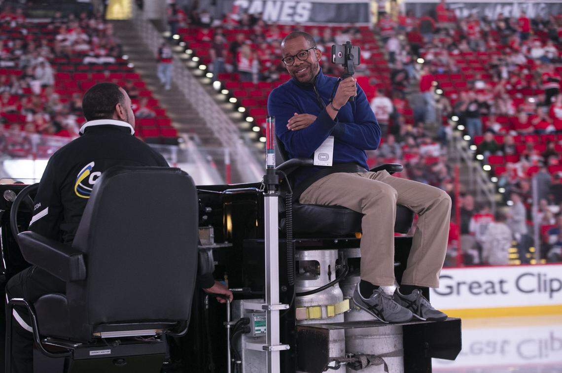 News & Observer reporter Jonas Pope IV rides along on an ice resurfacer between the first and second periods in Game 4 of the Stanley Cup series between the Islanders and Hurricanes on Friday, May 3, 2019 at PNC Arena in Raleigh, N.C.