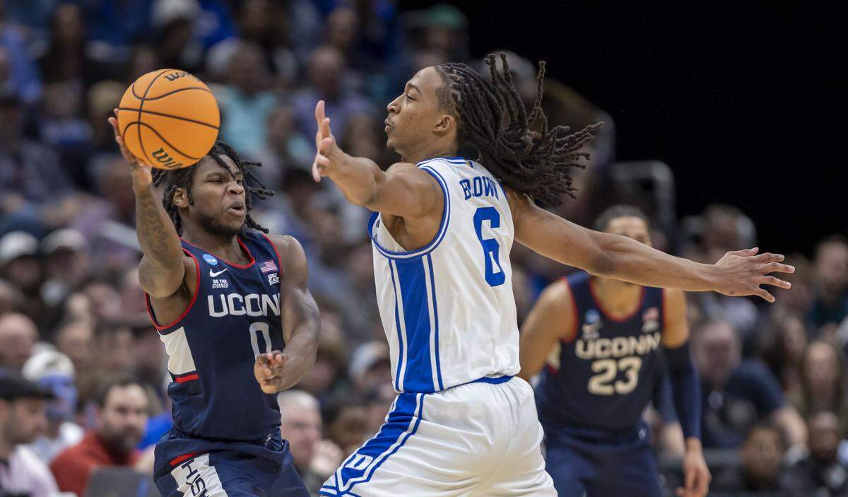 Duke forward Maliq Brown (6) defends Connecticut guard Malachi Smith (0) in the first half on Sunday, March 29, 2026, in the NCAA East Regional Championship, at Capital One Arena in Washington, D.C.