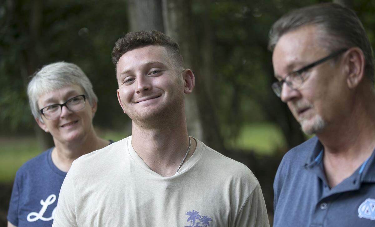 North Carolina pitcher Caden O’Brien with his guardians Carol and Eddie Cruse, photographed on Saturday, August 18, 2018 in Chapel Hill, N.C.