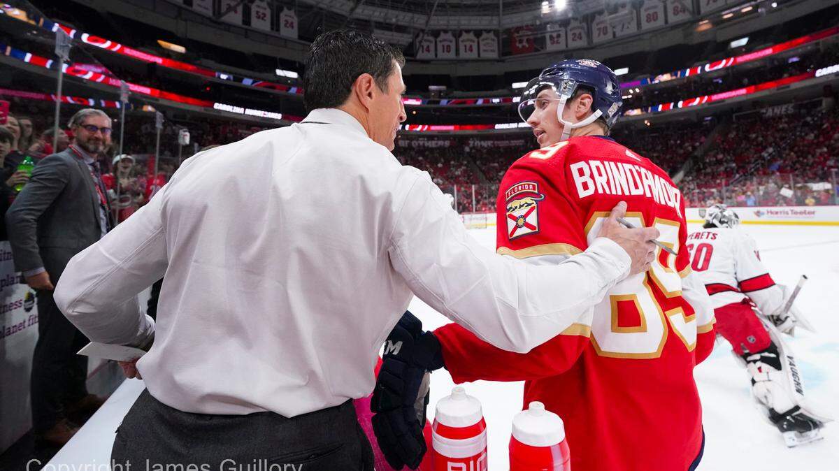 Sep 27, 2023; Raleigh, North Carolina, USA; Carolina Hurricanes head coach Rod Brind’Amour talks to his son Florida Panthers forward Skyler Brind’Amour (89) before the game at PNC Arena. Mandatory Credit: James Guillory-USA TODAY Sports
