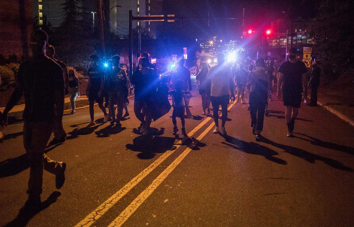 Protesters march towards the Durham Police Headquarters during a #RochelleBoysMatter protest in downtown Durham, N.C. on Friday, Sept. 4, 2020. The protest was organized for the second week in a row to demand transparency from Durham Police Department about an Aug. 21st incident in which five officers allegedly pointed guns at children three Black children playing tag at Rochelle Manor Apartments.