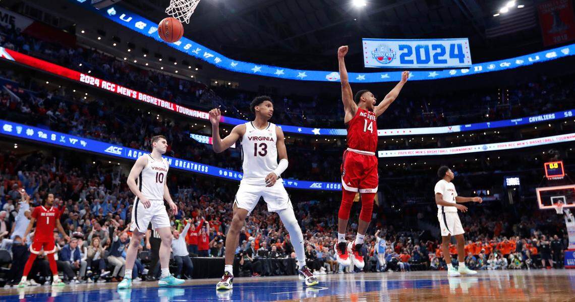 N.C. State’s Casey Morsell (14) celebrates after Michael O’Connell made a buzzer-beat to tie the game at the end of regulation during N.C. State’s 72-65 overtime victory over Virginia in the semifinals of the 2024 ACC Men’s Basketball Tournament at Capital One Arena in Washington, D.C., Friday, March 15, 2024.