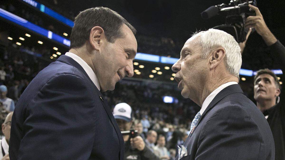 North Carolina coach Roy Williams and Duke coach Mike Krzyzewski greet each other prior to their game in the semifinals of the ACC Tournament at the Barclays Center in Brooklyn, NY.