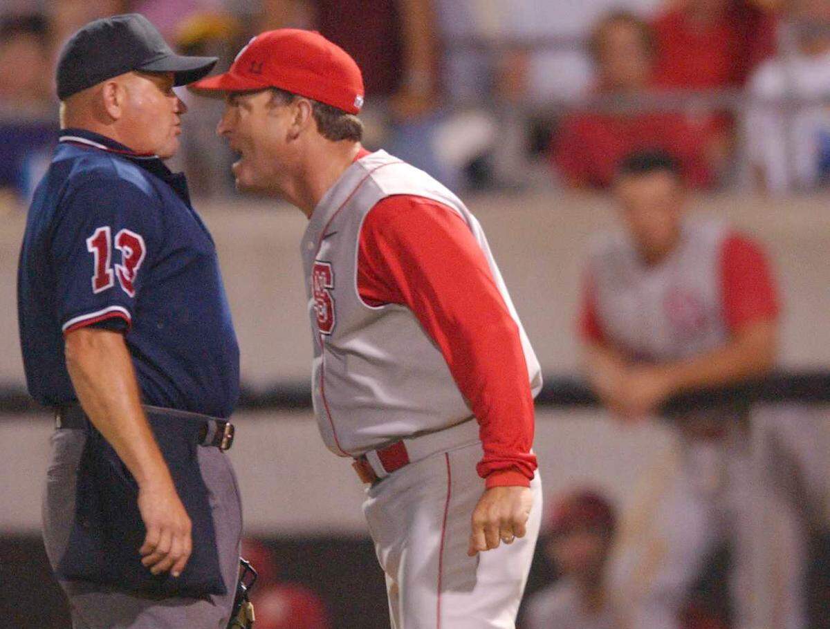 N.C. State head coach Elliott Avent gets in the face of home plate umpire Steve Sanders for the final word after being ejected from the game during the Wolfpack's game with East Carolina in 2004.