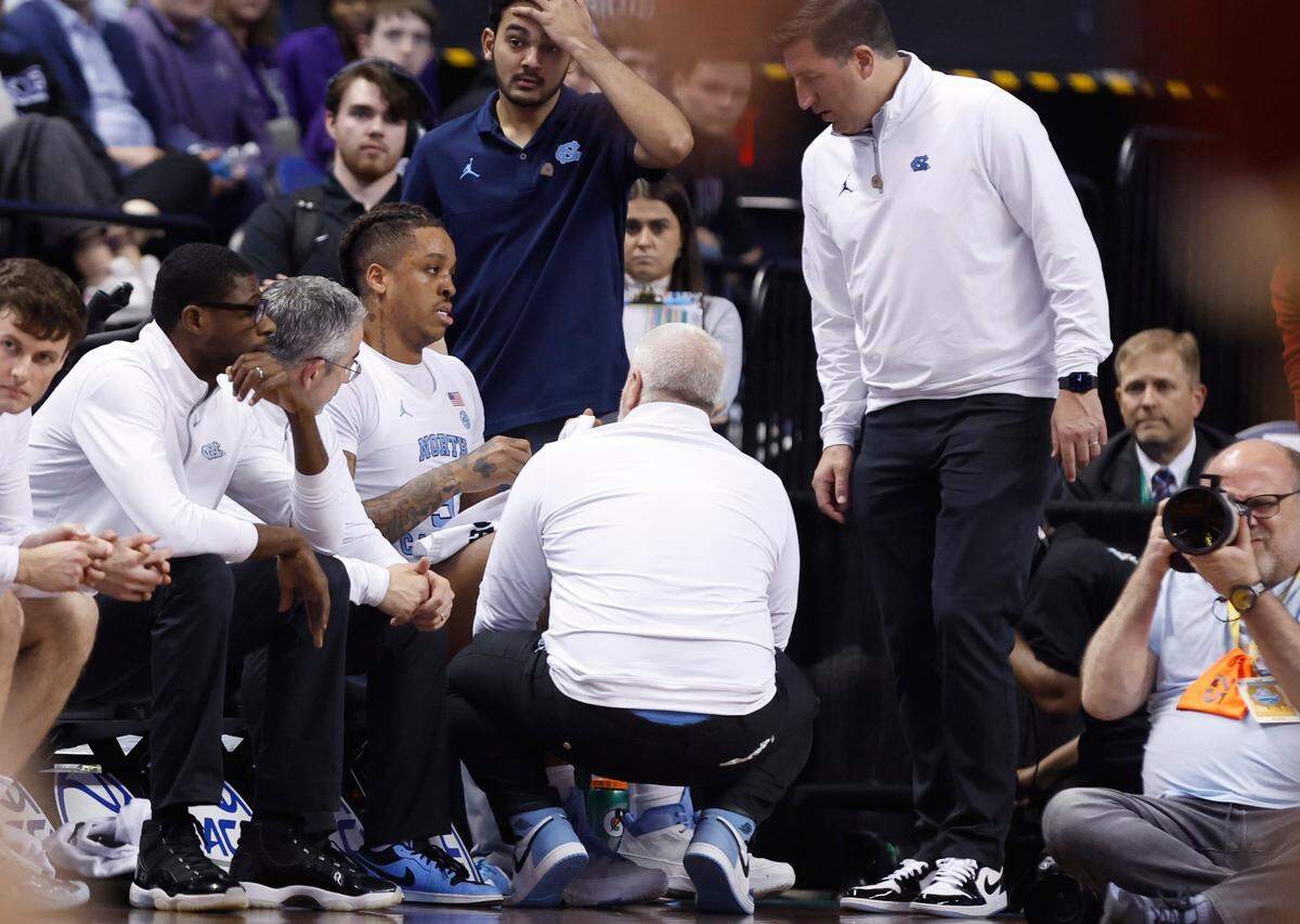 North Carolina’s Armando Bacot (5) is looked at after he was injured during the first half of UNC’s game against Boston College in the second round of the New York Life ACC Men’s Basketball Tournament in Greensboro, N.C., Wednesday, March 8, 2023.