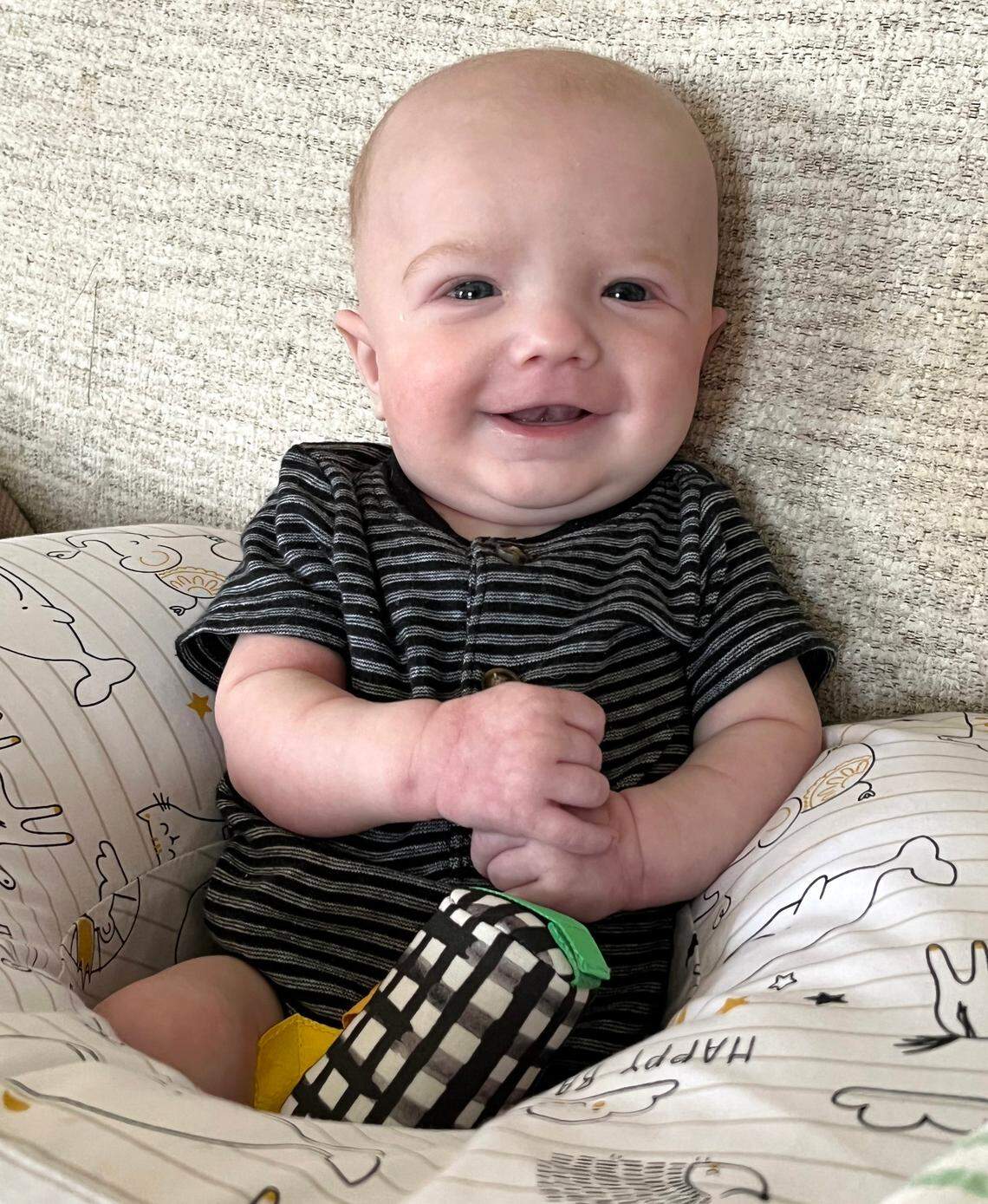 Owen Monroe smiles at his home in August 2022.