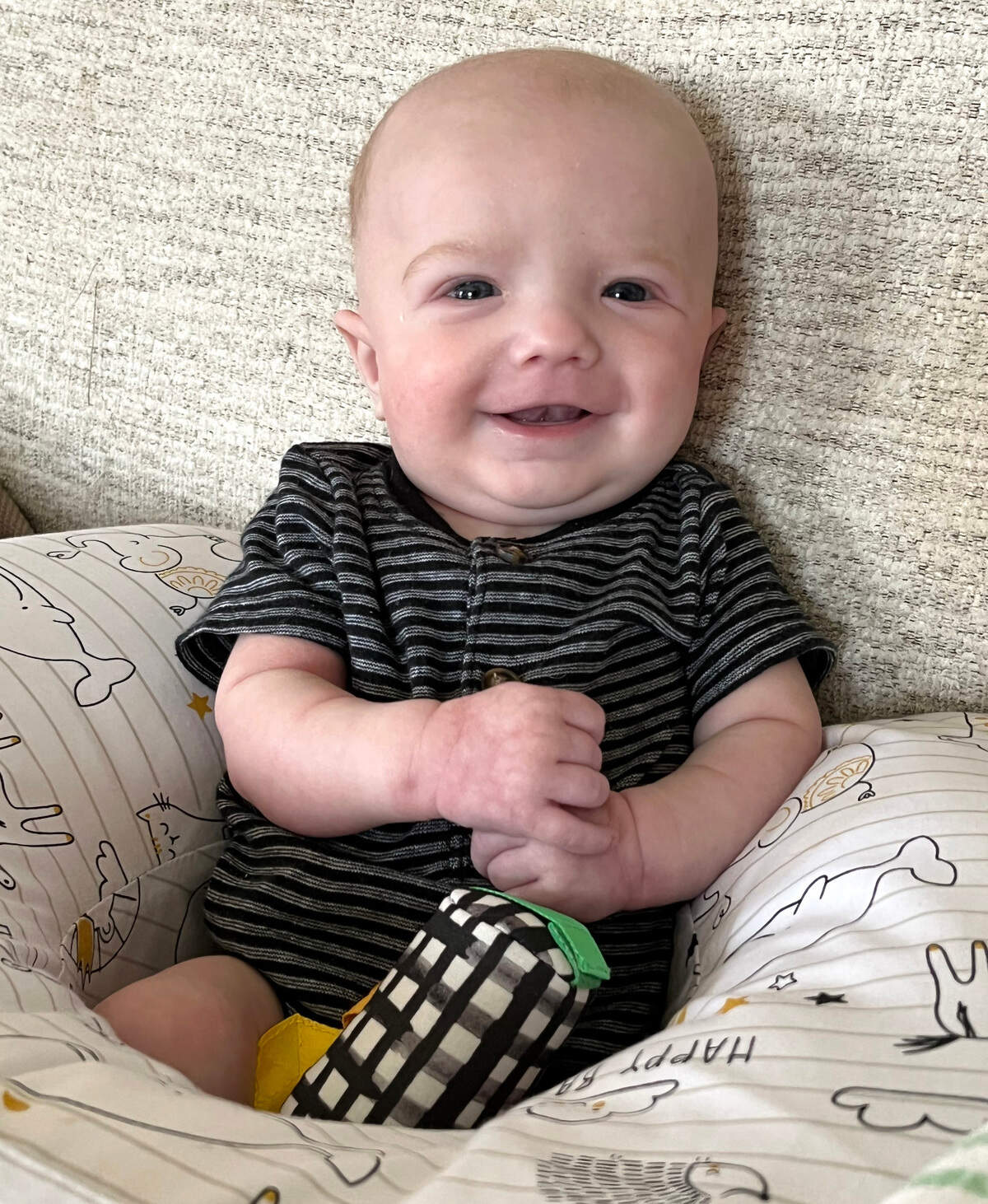Owen Monroe smiles at his home in August 2022.