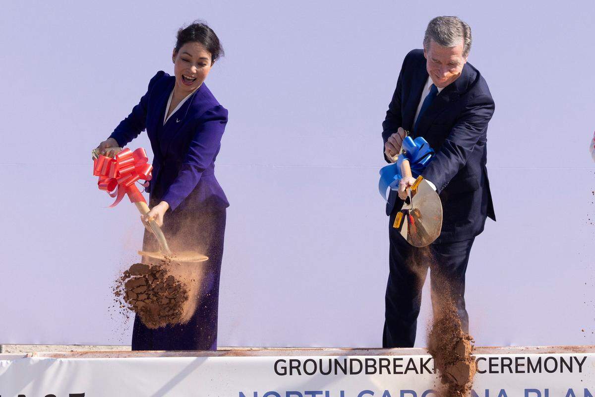 VinFast former CEO Le Thi Thu Thuy and Gov. Roy Cooper participate in a groundbreaking ceremony on July 28, 2023 at the promised future site of a Vinfast electric vehicle plant in Chatham County