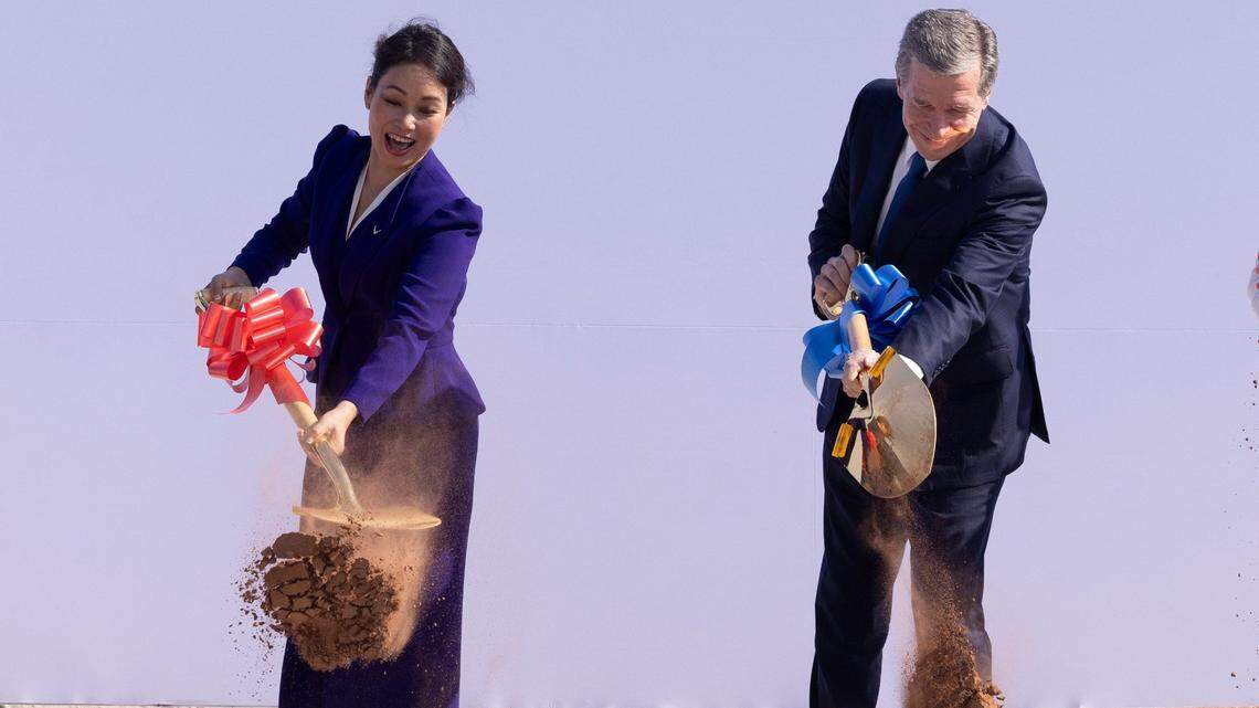 VinFast former CEO Le Thi Thu Thuy and Gov. Roy Cooper participate in a groundbreaking ceremony on July 28, 2023 at the future site of a Vinfast electric vehicle plant in Chatham County