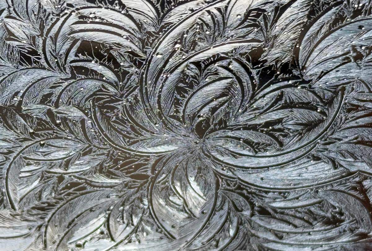 Ice as seen through a car window in Raleigh, N.C., Saturday, Jan. 11, 2025. As the climate has warmed over the past 30 years, the last frost and freeze of winter come a week earlier and the first frost and freeze of fall arrive a week later, stretching out the growing season. 