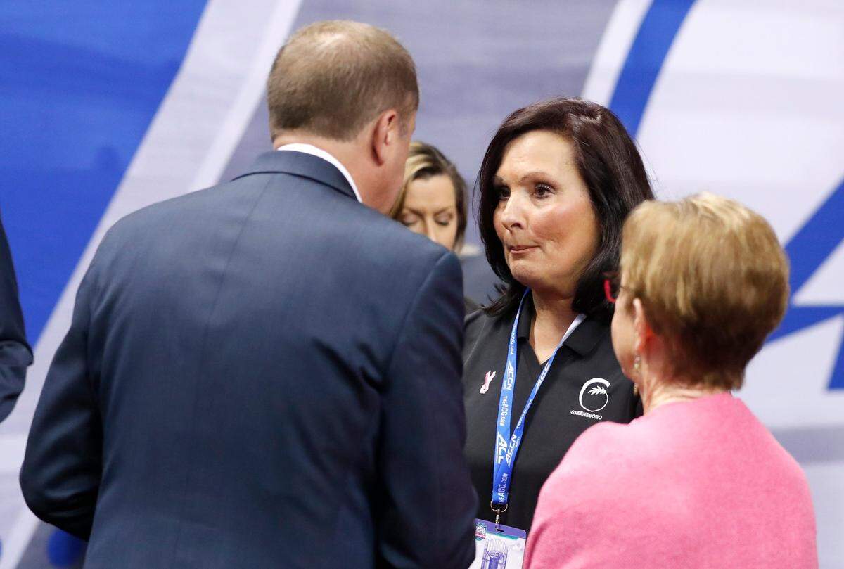 Greensboro mayor Nancy Vaughan talks with ACC Commissioner Jim Phillips during N.C. States game against Miami in the championship of the ACC womens basketball tournament in Greensboro, N.C., Sunday, March 6, 2022.