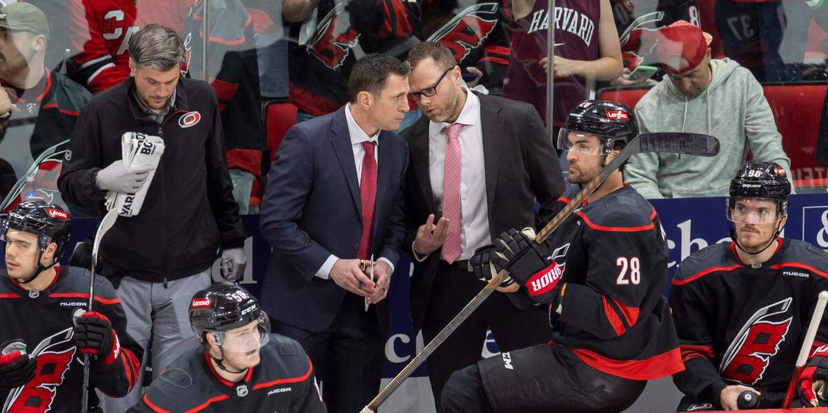 Carolina Hurricanes coach Rod BrindÕAmour confers with assistant coach Tim Gleason in the third period during game two of their Stanley Cup playoff series against the New Jersey Devils on Tuesday, April 22, 2025 at Lenovo Center in Raleigh, N.C.