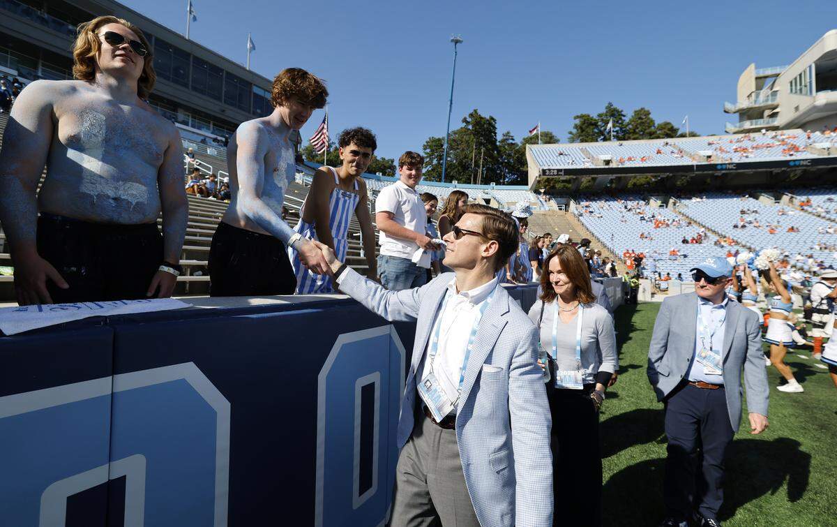 UNC Chancellor Lee Roberts greets fans late in the second half of Clemson’s 38-10 victory over UNC at Kenan Stadium in Chapel Hill, N.C., Sat. Oct. 4, 2025.