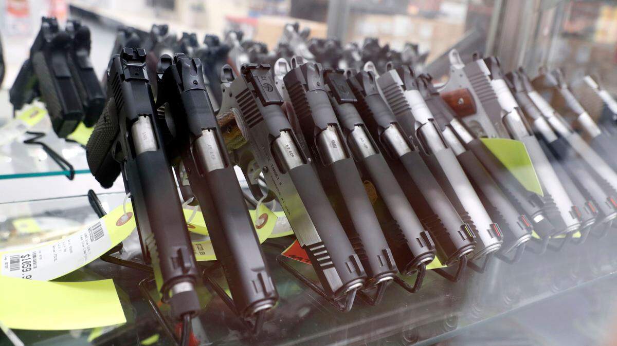 Handguns on display at Perry’s Gun Shop in Wendell, N.C., on Tuesday, March 24, 2020.