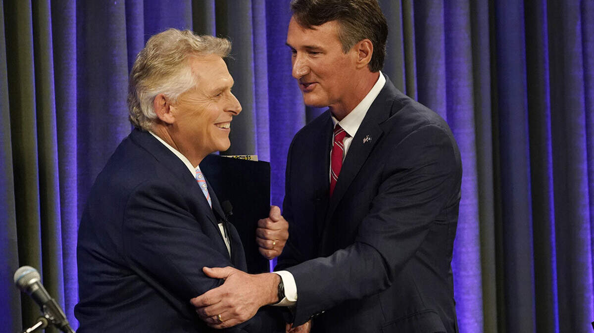Democratic gubernatorial candidate and former governor Terry McAuliffe, left, greets his Republican challenger, Glenn Youngkin, after a debate at the Appalachian School of Law in Grundy, Va., Thursday, Sept. 16, 2021. | (Steve Helber/AP Photo)