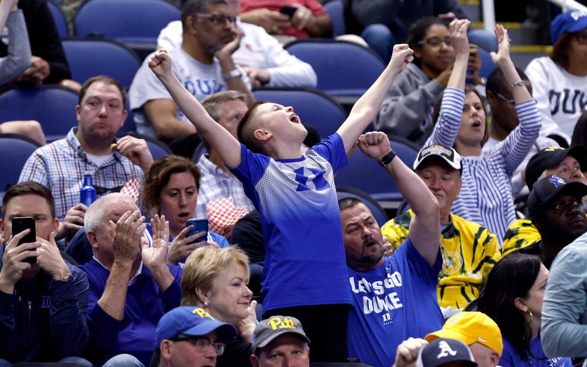 Fans cheer on the Blue Devils during the second half of Duke’s game against Pitt in the quarterfinals of the ACC Men’s Basketball Tournament in Greensboro, N.C., Thursday, March 9, 2023.