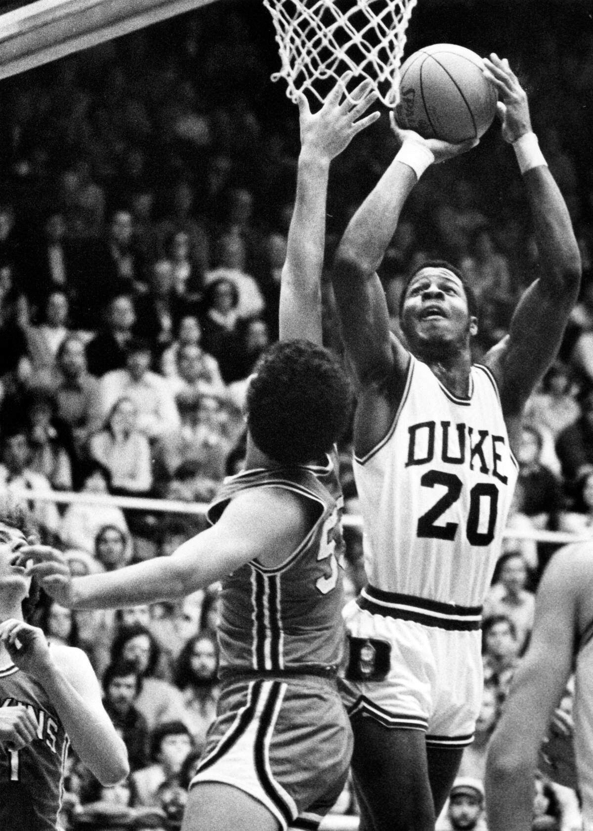Duke rookie Gene Banks goes up over Johns Hopkins’ center David Nagelberg in 1977.