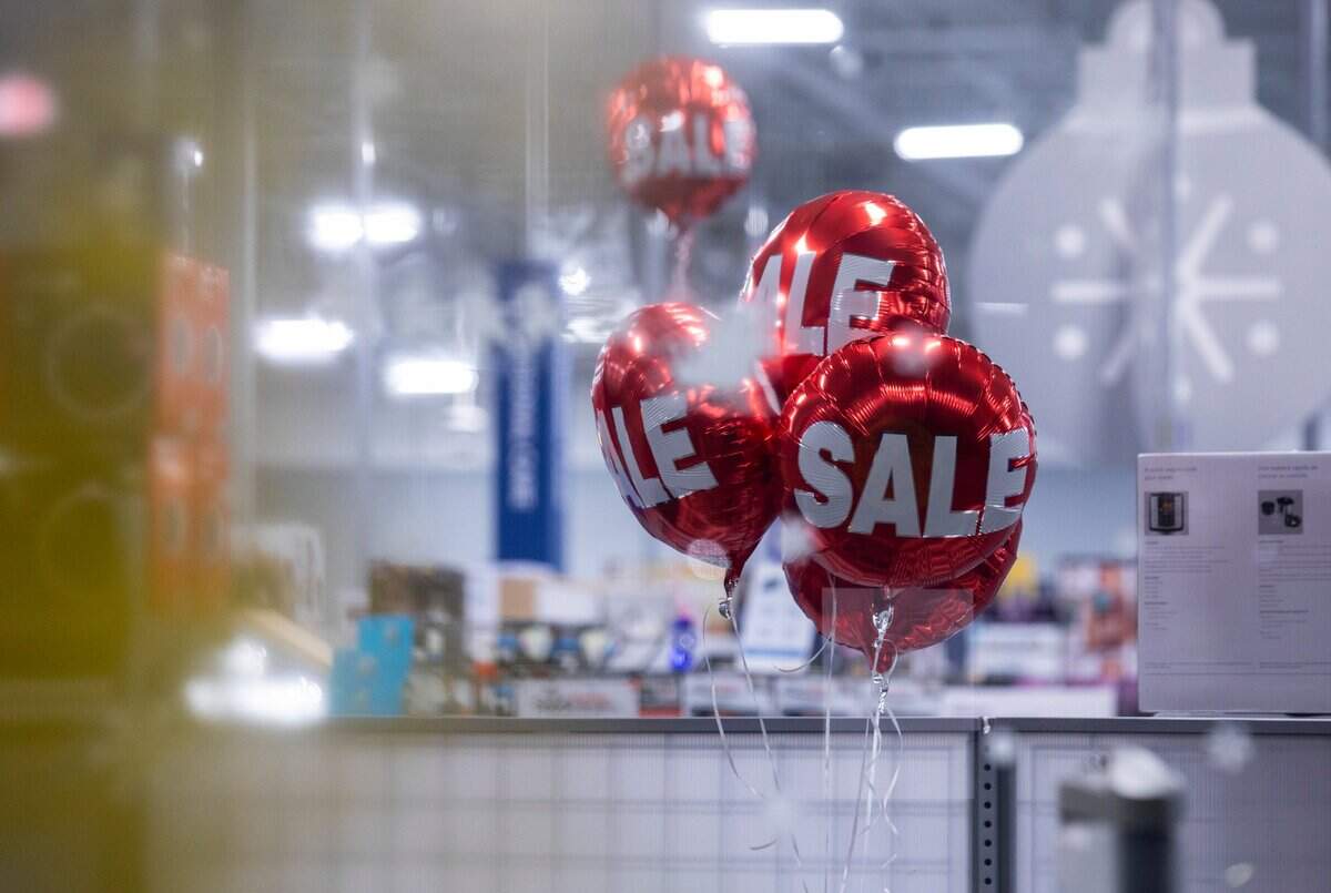 Balloons inside a Best Buy in Durham, N.C. can be seen through the front door on Black Friday, Nov. 26, 2021.