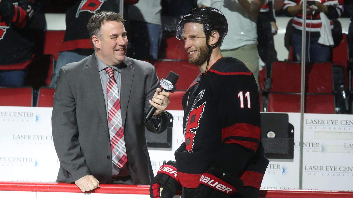 Carolina Hurricanes broadcaster Mike Maniscalco, left, interviews Canes captain Jordan Staal. Maniscalco was hospitalized in California on Wednesday after doctors discovered a mass in his abdomen and will be off the air indefinitely.
