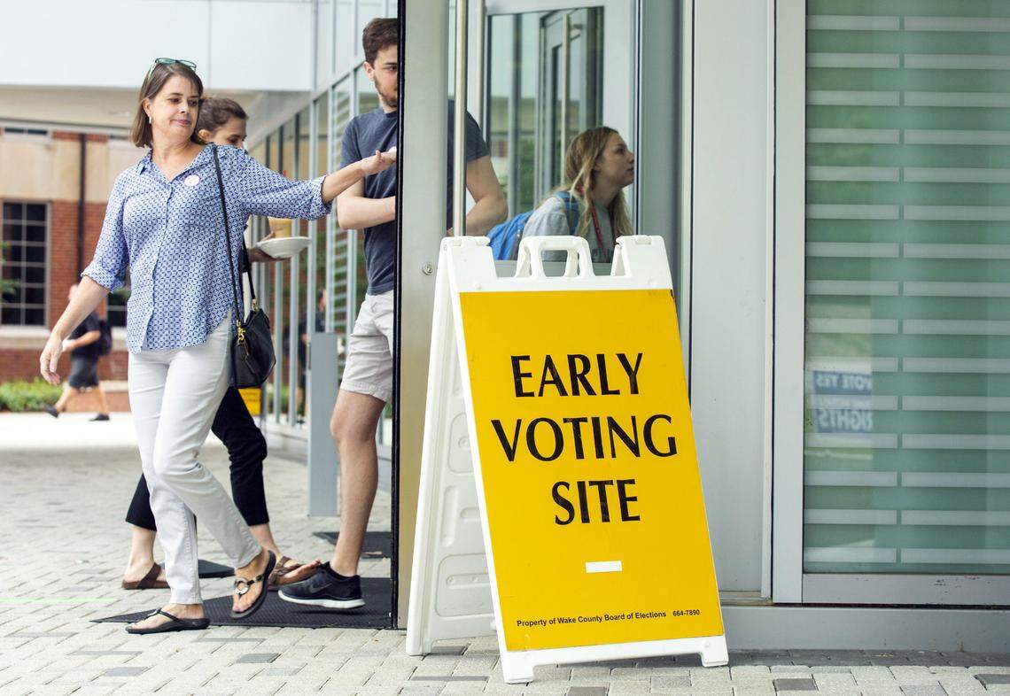 Terry Kallam, left, and her son, Alex Kallam, leave the N.C. State University Talley Student Union after casting their ballots on the first day of early voting in the November midterm elections on Wednesday, Oct. 17, 2018, in Raleigh, NC.