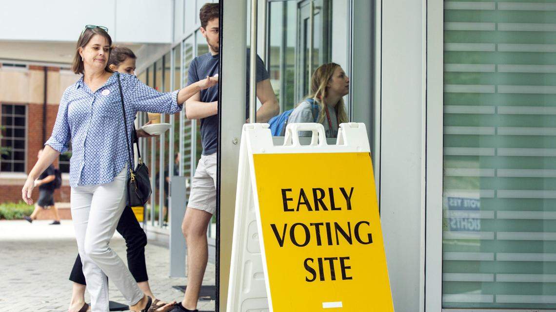 Terry Kallam, left, and her son, Alex Kallam, leave the N.C. State University Talley Student Union after casting their ballots on the first day of early voting in the November midterm elections on Wednesday, Oct. 17, 2018, in Raleigh, NC.