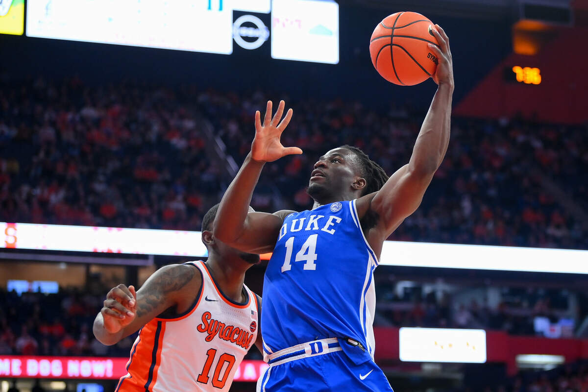 Duke Blue Devils guard Sion James (14) shoots against Syracuse Orange center Naheem McLeod (10) during the first half at the JMA Wireless Dome on Wednesday, Feb. 5, 2025.