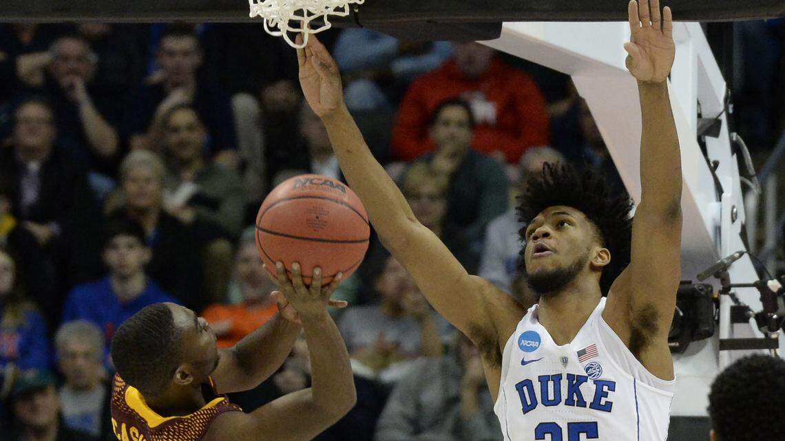 Duke forward Marvin Bagley III (35) contests a first half shot by Iona's Schadrac Casimir (4).