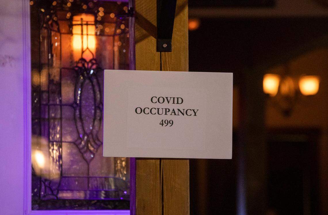 A sign designates the occupancy limit at the Cornerstone Tavern on Glenwood Avenue, which opened its doors for business despite Gov. Roy CooperÕs veto of legislation to reopen bars and a judgeÕs decision hours earlier denying a lawsuit brought against the governorÕs executive orders by the N.C. Bar and Tavern Association, on Friday, Jun. 26, 2020, in Raleigh, N.C.